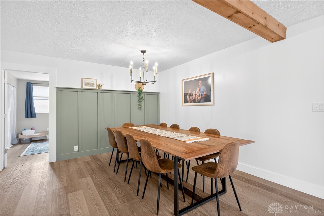 7888 Darke-Preble County Line Road Arcanum, OH 45304 - Photo 15 of 51 This dining room offers a warm and inviting atmosphere, perfect for memorable gatherings.