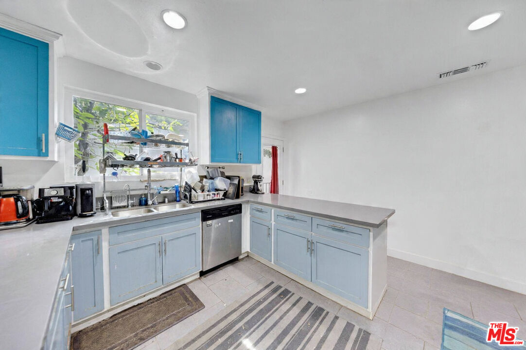 8600 La Tuna Canyon Road Sun Valley, CA 91352 - Photo 17 of 60 a kitchen with stainless steel appliances granite countertop a sink stove and cabinets
