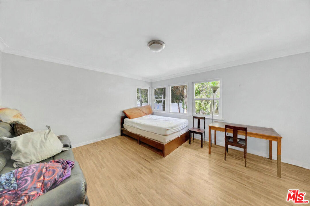 8600 La Tuna Canyon Road Sun Valley, CA 91352 - Photo 28 of 60 a bedroom with a bed and a wooden floor