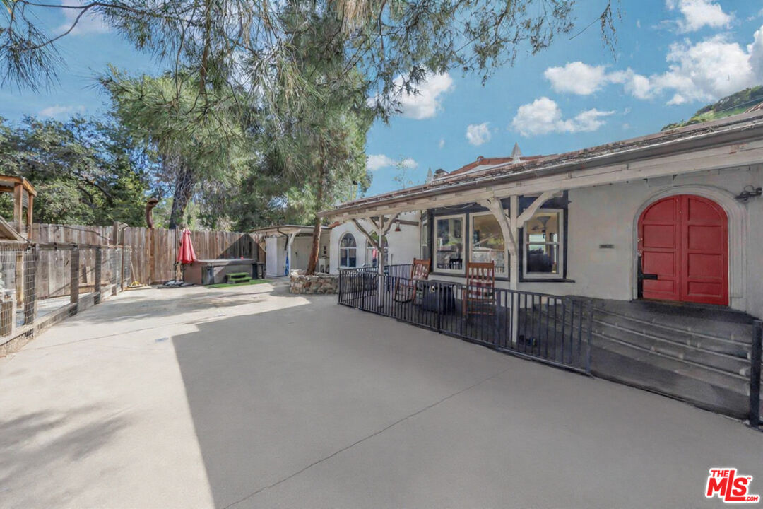 8600 La Tuna Canyon Road Sun Valley, CA 91352 - Photo 3 of 60 a front view of a house with a yard and garage