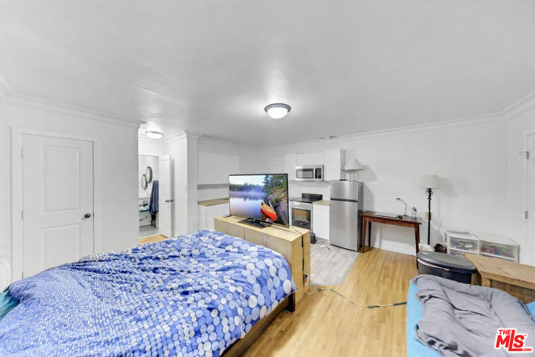 8600 La Tuna Canyon Road Sun Valley, CA 91352 - Photo 32 of 60 a bedroom with a bed and a view of kitchen