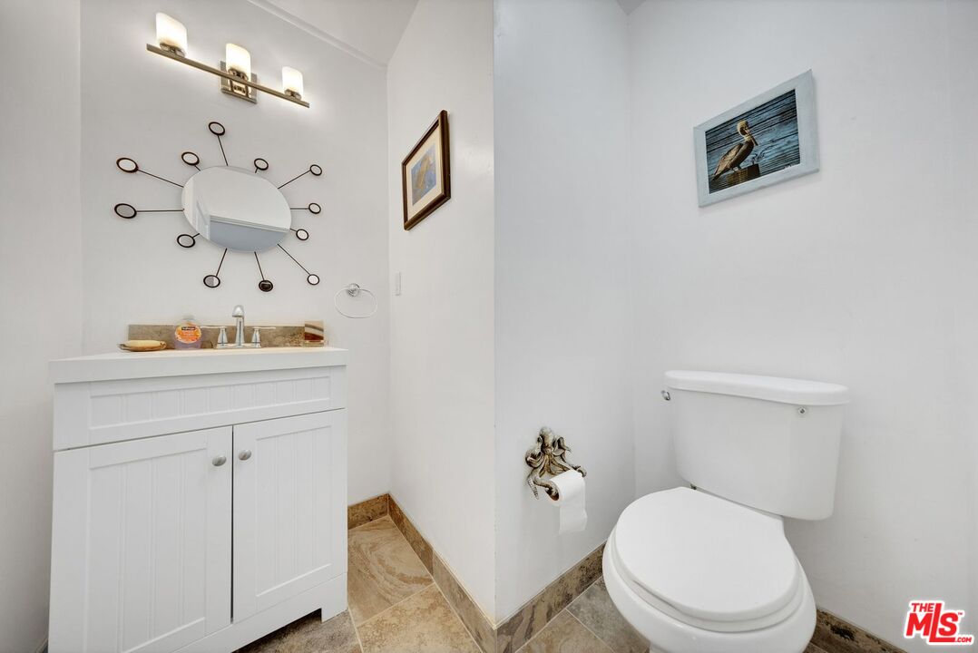 8600 La Tuna Canyon Road Sun Valley, CA 91352 - Photo 39 of 60 a white toilet sitting next to a bathroom sink