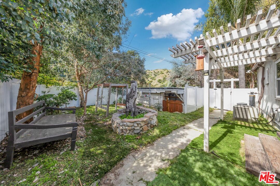 8600 La Tuna Canyon Road Sun Valley, CA 91352 - Photo 47 of 60 a backyard of a house with barbeque oven fire pit and outdoor seating