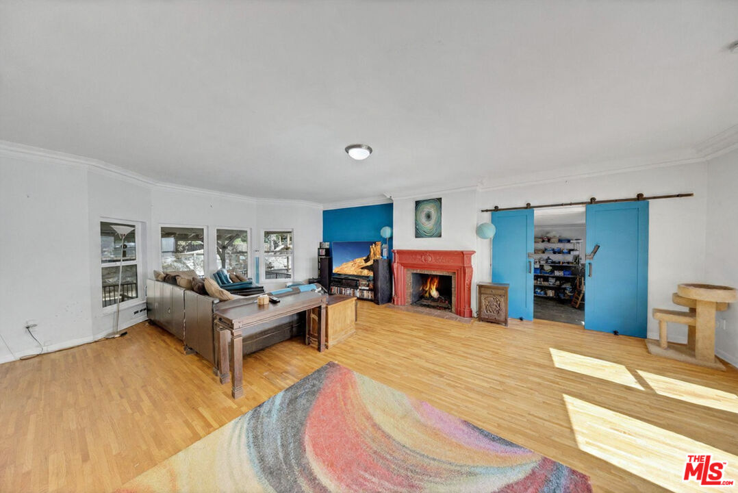 8600 La Tuna Canyon Road Sun Valley, CA 91352 - Photo 9 of 60 a bed room with furniture and a fireplace