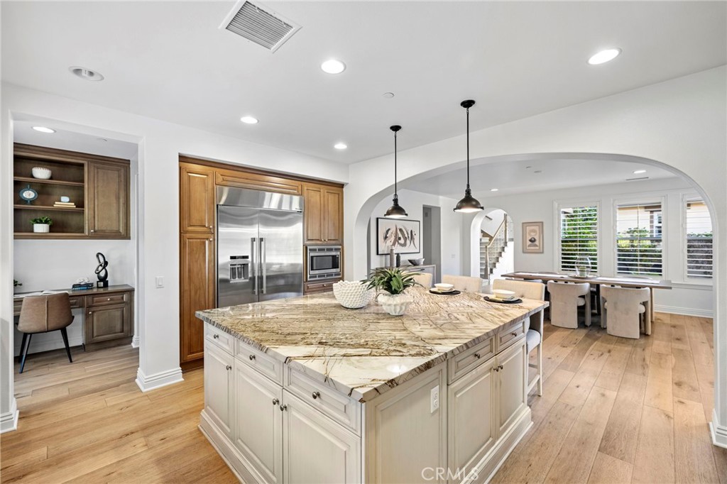10 Gaucho Road Ladera Ranch, CA 92694 - Photo 11 of 52 a large kitchen with kitchen island a large island in it