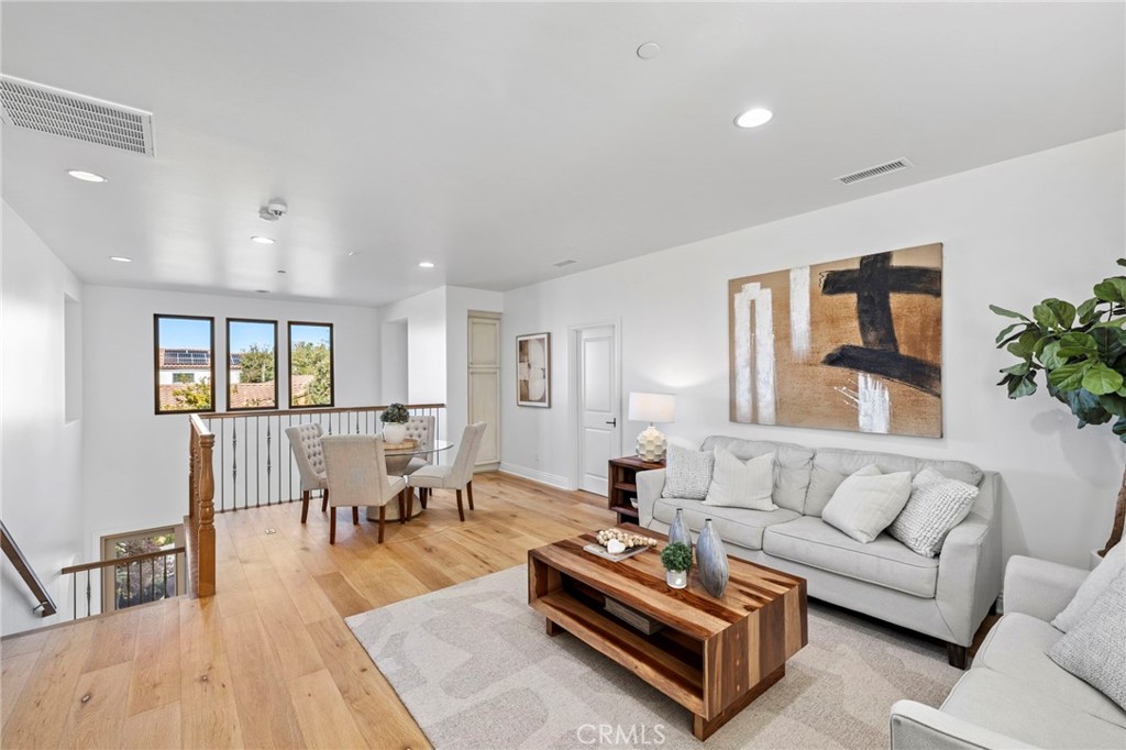 10 Gaucho Road Ladera Ranch, CA 92694 - Photo 16 of 52 a living room with furniture and wooden floor