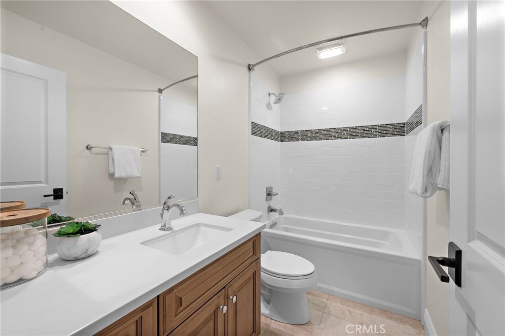 10 Gaucho Road Ladera Ranch, CA 92694 - Photo 21 of 52 a bathroom with a granite countertop sink mirror vanity and toilet