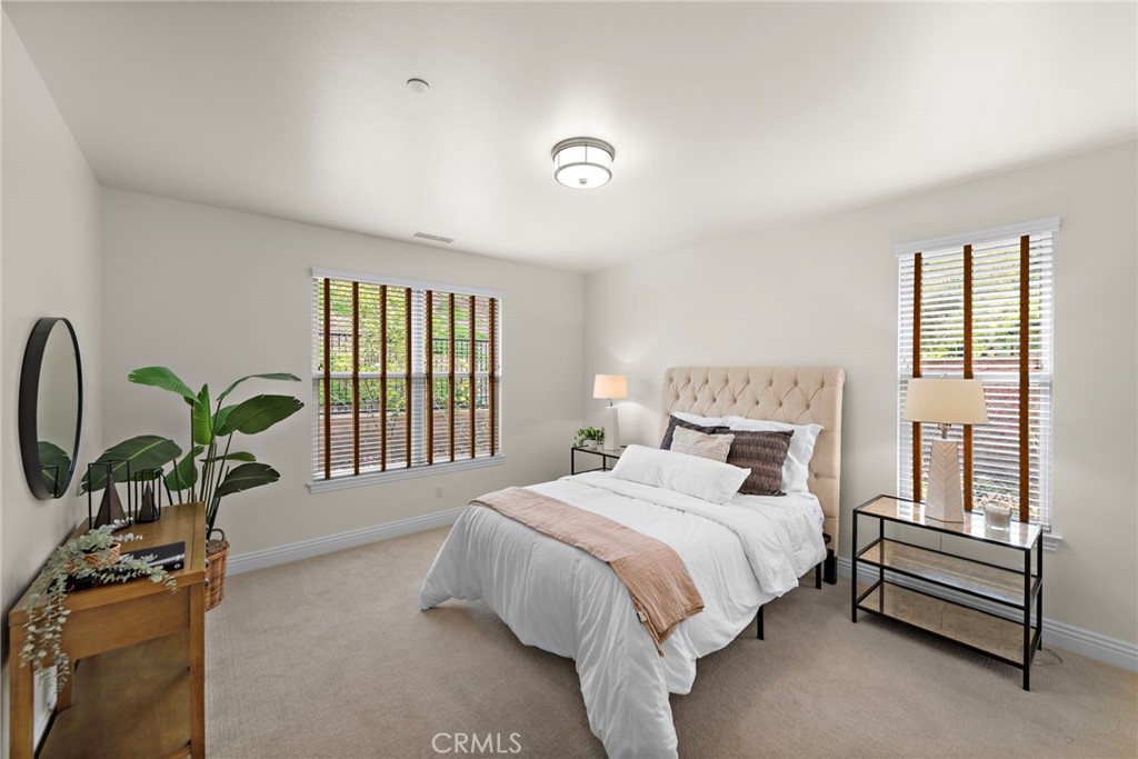 10 Gaucho Road Ladera Ranch, CA 92694 - Photo 22 of 52 a bedroom with a bed and a large window