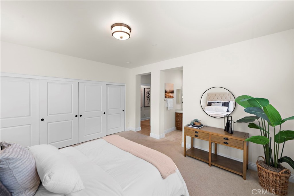 10 Gaucho Road Ladera Ranch, CA 92694 - Photo 23 of 52 a bedroom with bed and a chandelier