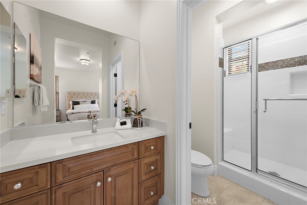 10 Gaucho Road Ladera Ranch, CA 92694 - Photo 24 of 52 a spacious bathroom with a toilet a sink a mirror and a shower