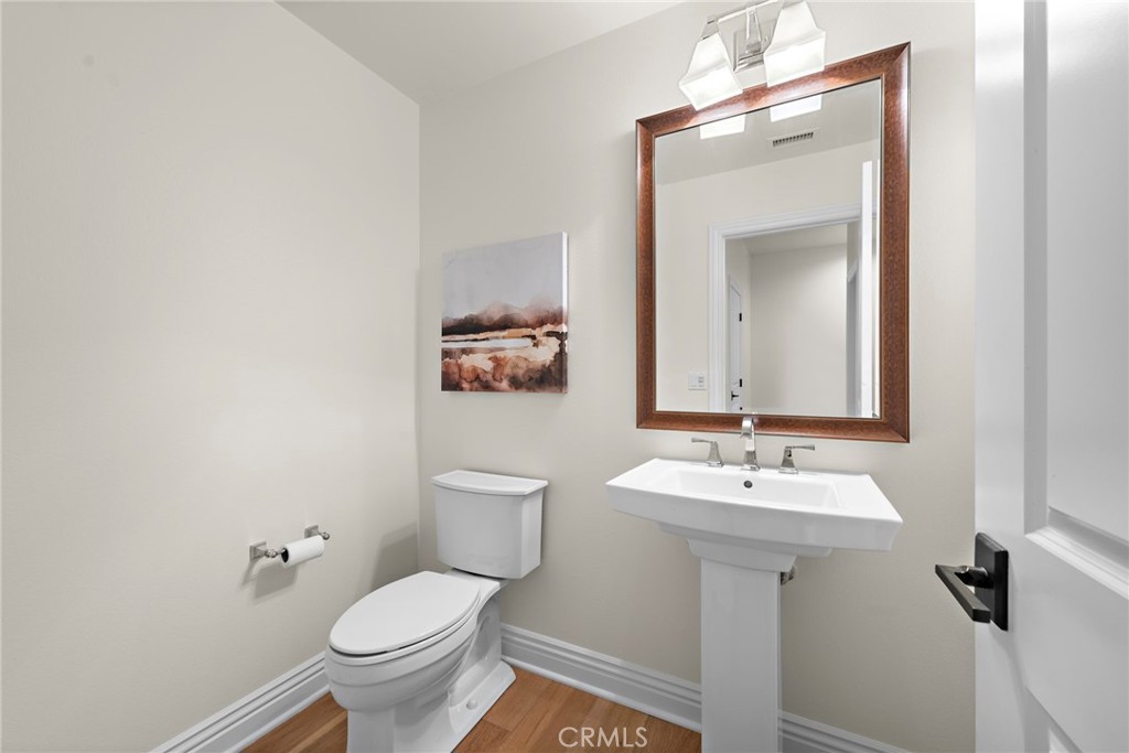 10 Gaucho Road Ladera Ranch, CA 92694 - Photo 27 of 52 a bathroom with a toilet sink and mirror