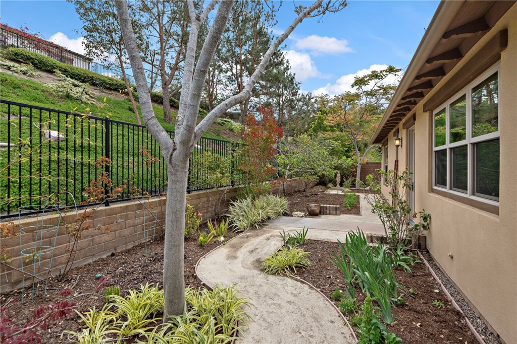 10 Gaucho Road Ladera Ranch, CA 92694 - Photo 31 of 52 a view of a garden with a bench in patio