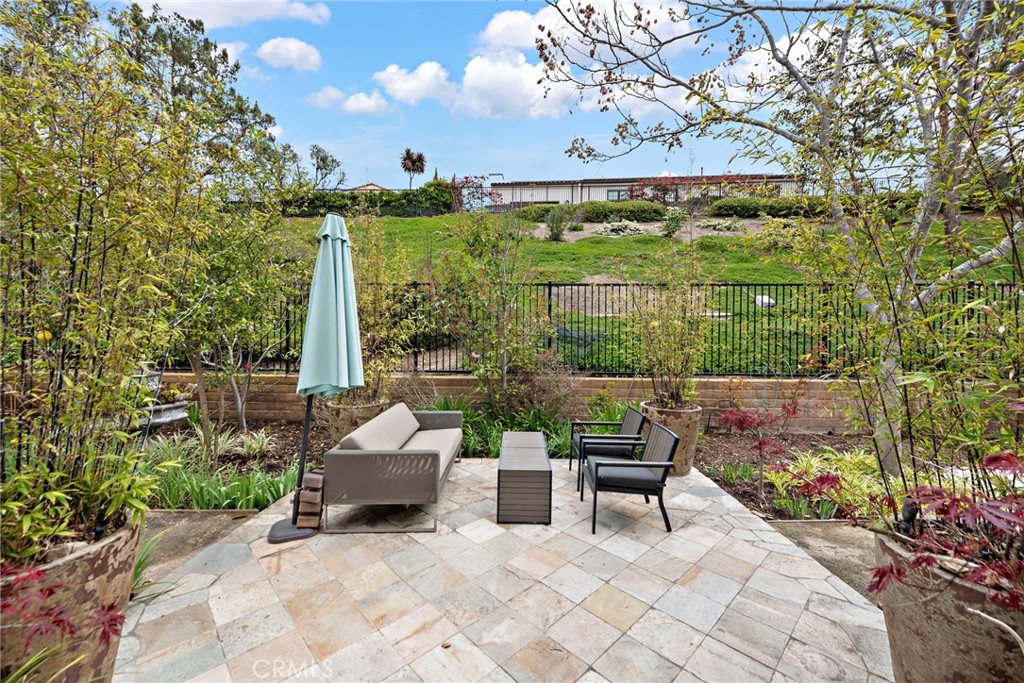 10 Gaucho Road Ladera Ranch, CA 92694 - Photo 32 of 52 a view of a patio with a table and chairs and potted plants