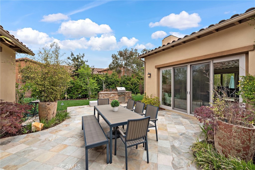 10 Gaucho Road Ladera Ranch, CA 92694 - Photo 35 of 52 a view of a patio with table and chairs and potted plants