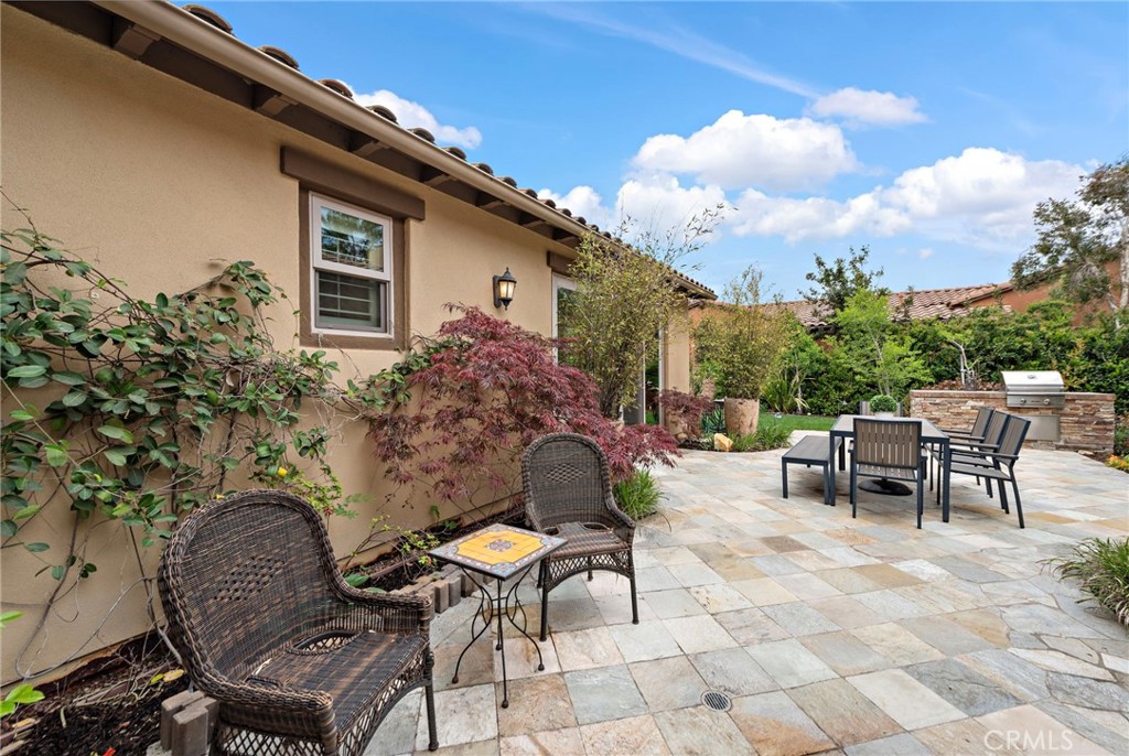 10 Gaucho Road Ladera Ranch, CA 92694 - Photo 36 of 52 a backyard of a house with table and chairs