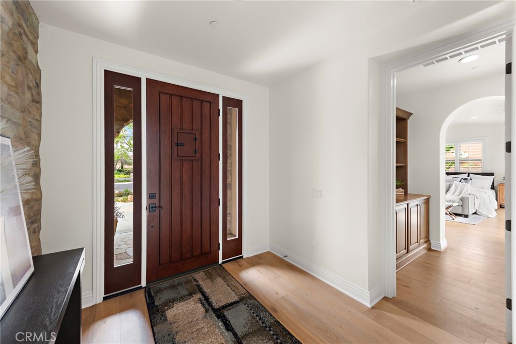 10 Gaucho Road Ladera Ranch, CA 92694 - Photo 6 of 52 a view of a hallway with wooden floor and furniture