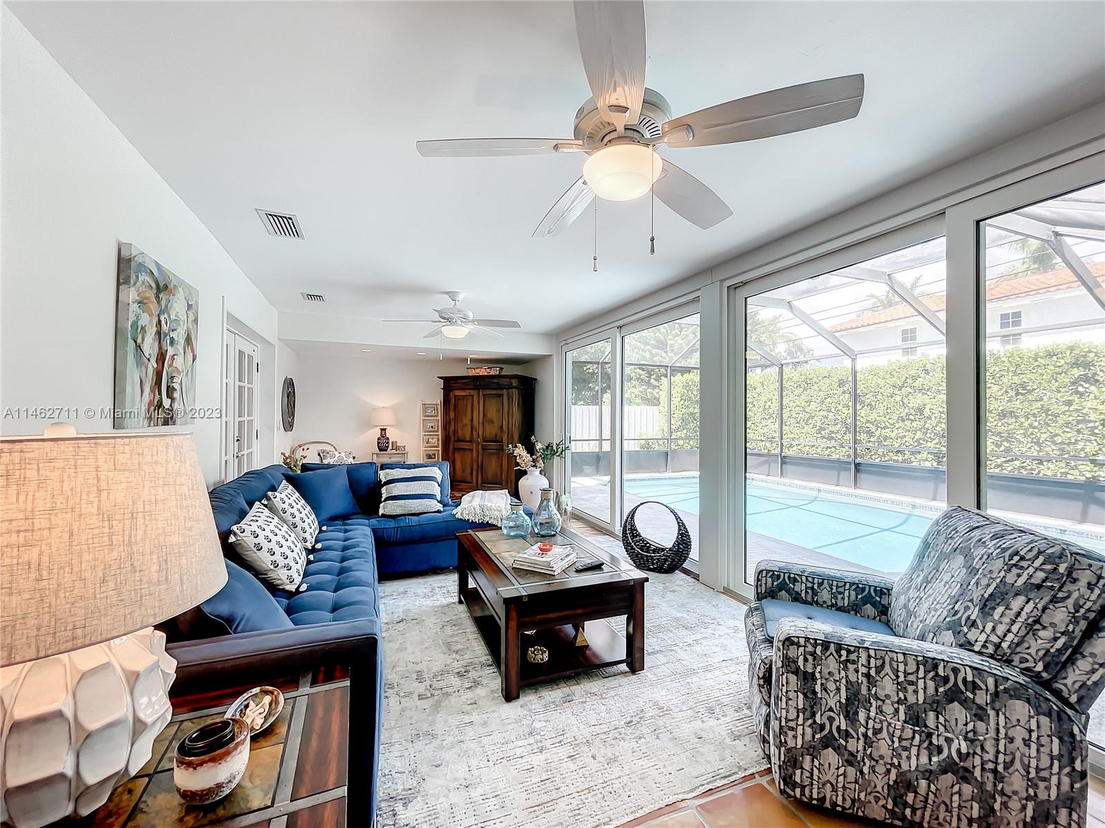 9035 Southwest 48th Terrace Miami, FL 33165 - Photo 13 of 37 a living room with furniture and a large window