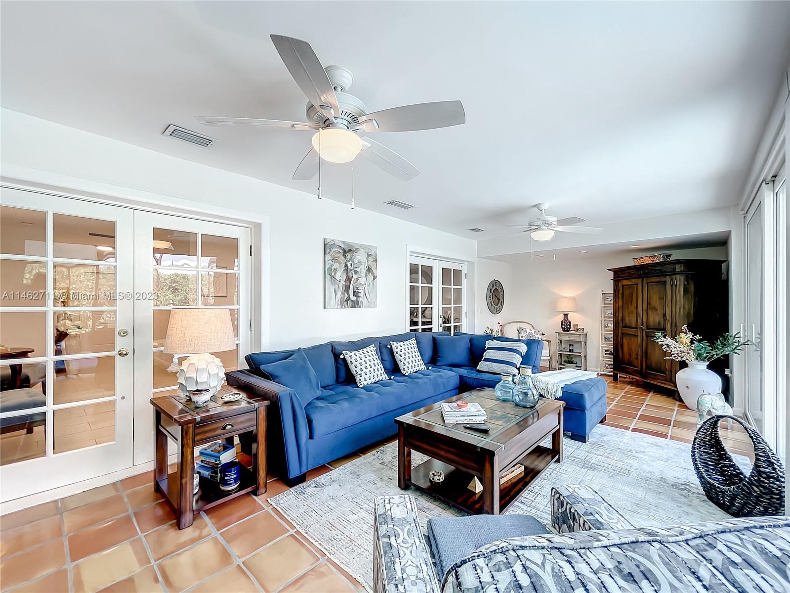 9035 Southwest 48th Terrace Miami, FL 33165 - Photo 14 of 37 a living room with furniture and a large window
