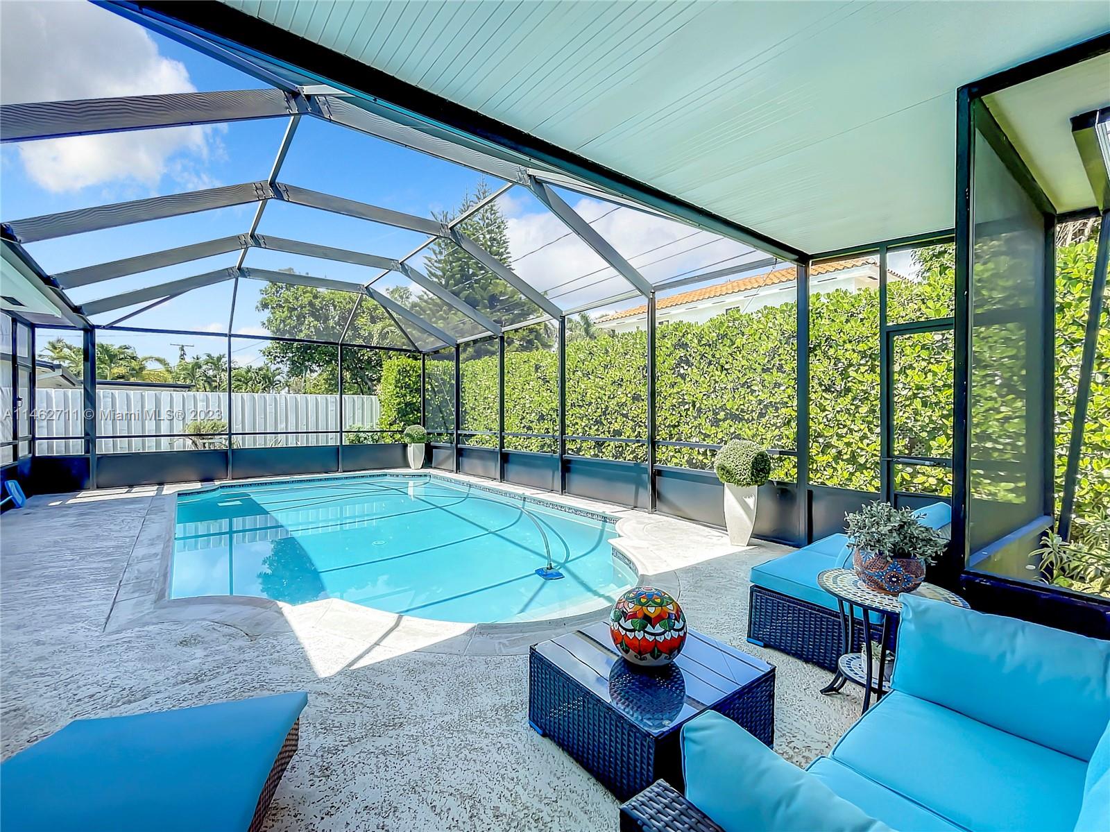 9035 Southwest 48th Terrace Miami, FL 33165 - Photo 18 of 37 a living room with furniture and a large window