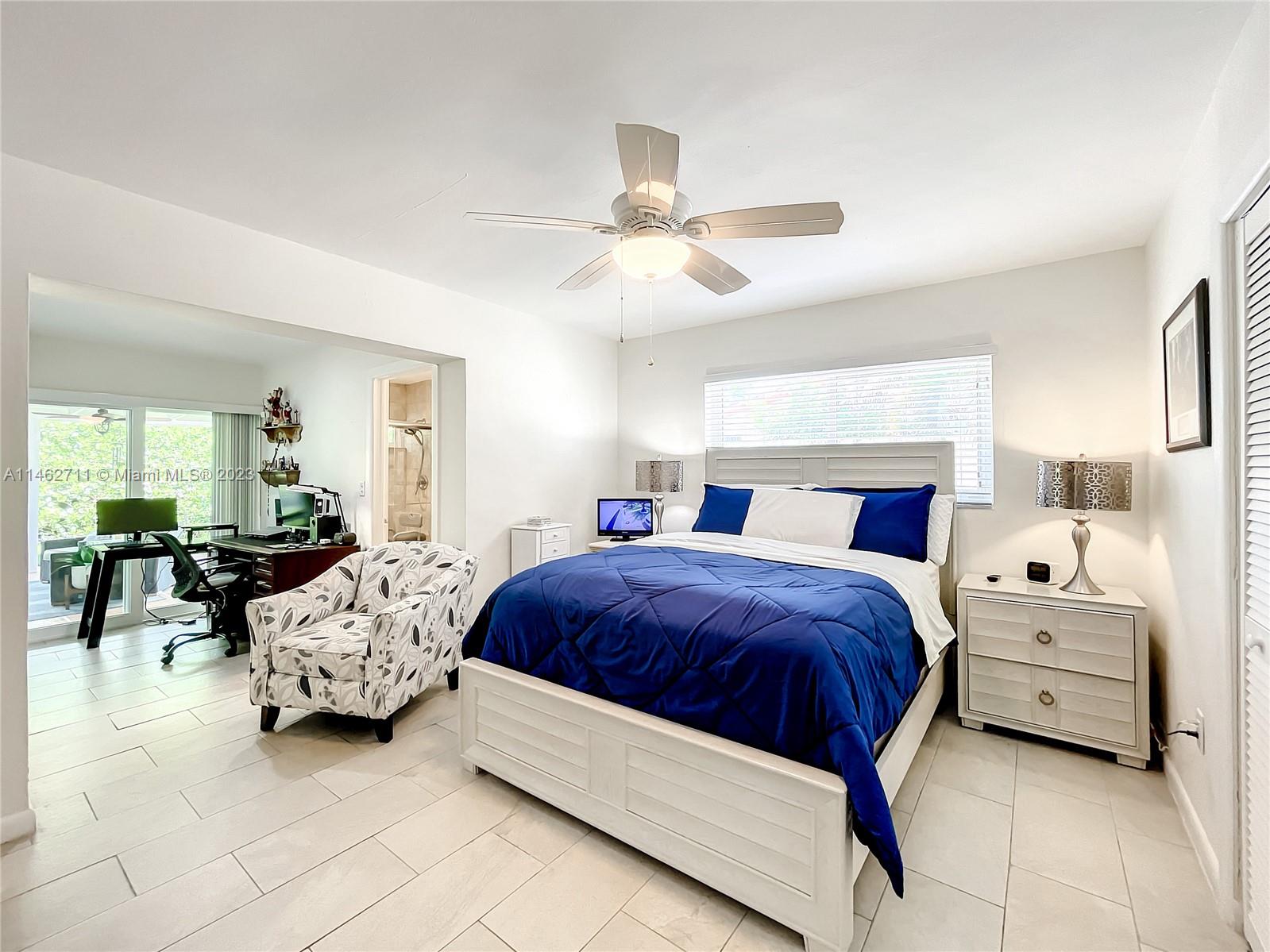 9035 Southwest 48th Terrace Miami, FL 33165 - Photo 21 of 37 a bedroom with bed and window