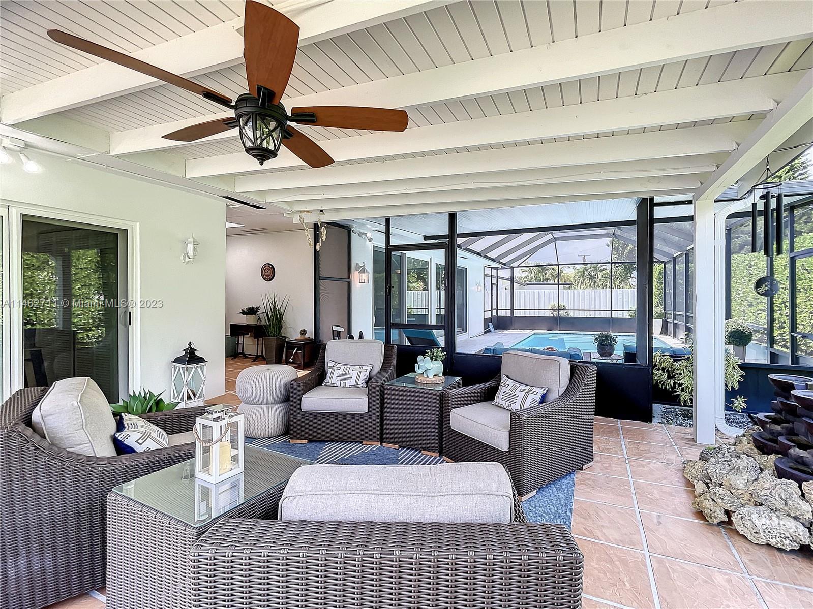 9035 Southwest 48th Terrace Miami, FL 33165 - Photo 26 of 37 a living room with furniture and a large window