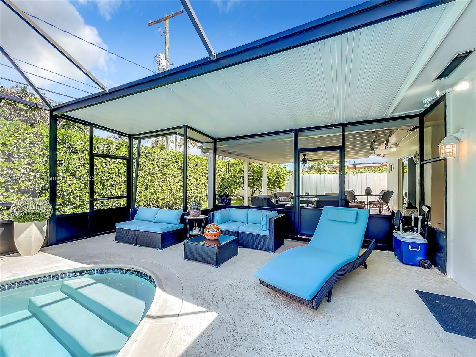 9035 Southwest 48th Terrace Miami, FL 33165 - Photo 27 of 37 a living room with furniture and floor to ceiling window