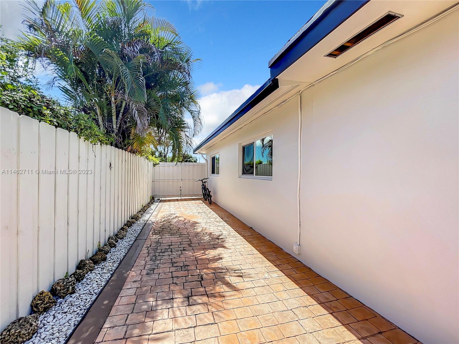 9035 Southwest 48th Terrace Miami, FL 33165 - Photo 28 of 37 a view of backyard with pathway
