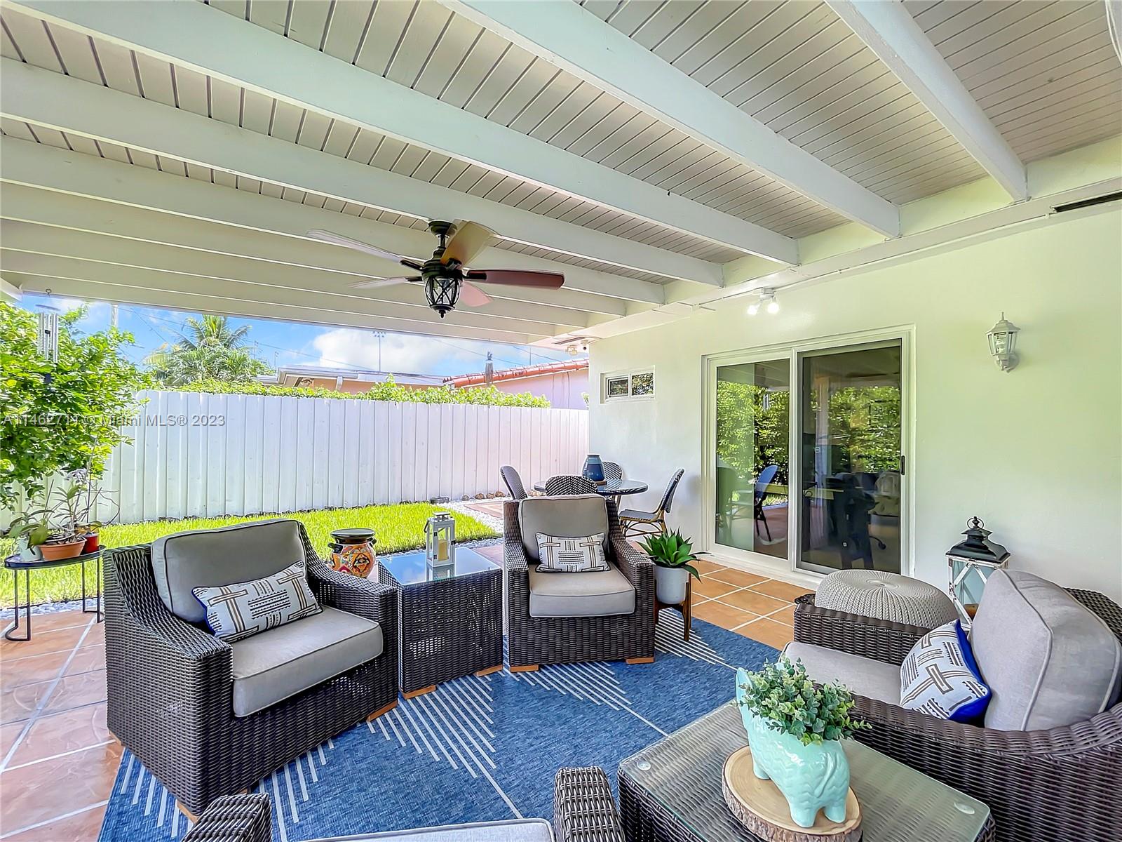 9035 Southwest 48th Terrace Miami, FL 33165 - Photo 30 of 37 a building outdoor space with patio furniture