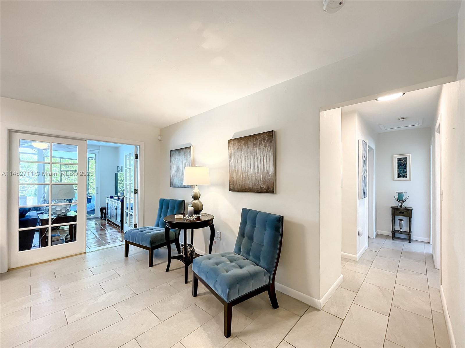 9035 Southwest 48th Terrace Miami, FL 33165 - Photo 4 of 37 a living room with furniture and a window