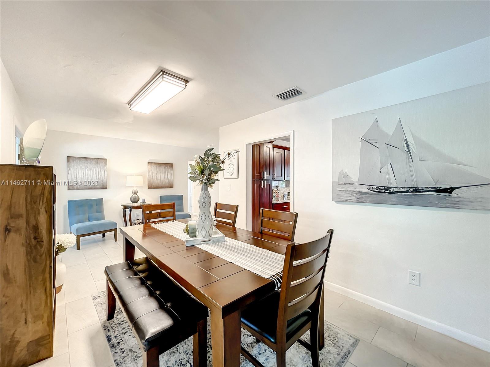 9035 Southwest 48th Terrace Miami, FL 33165 - Photo 6 of 37 a view of a dining room with furniture