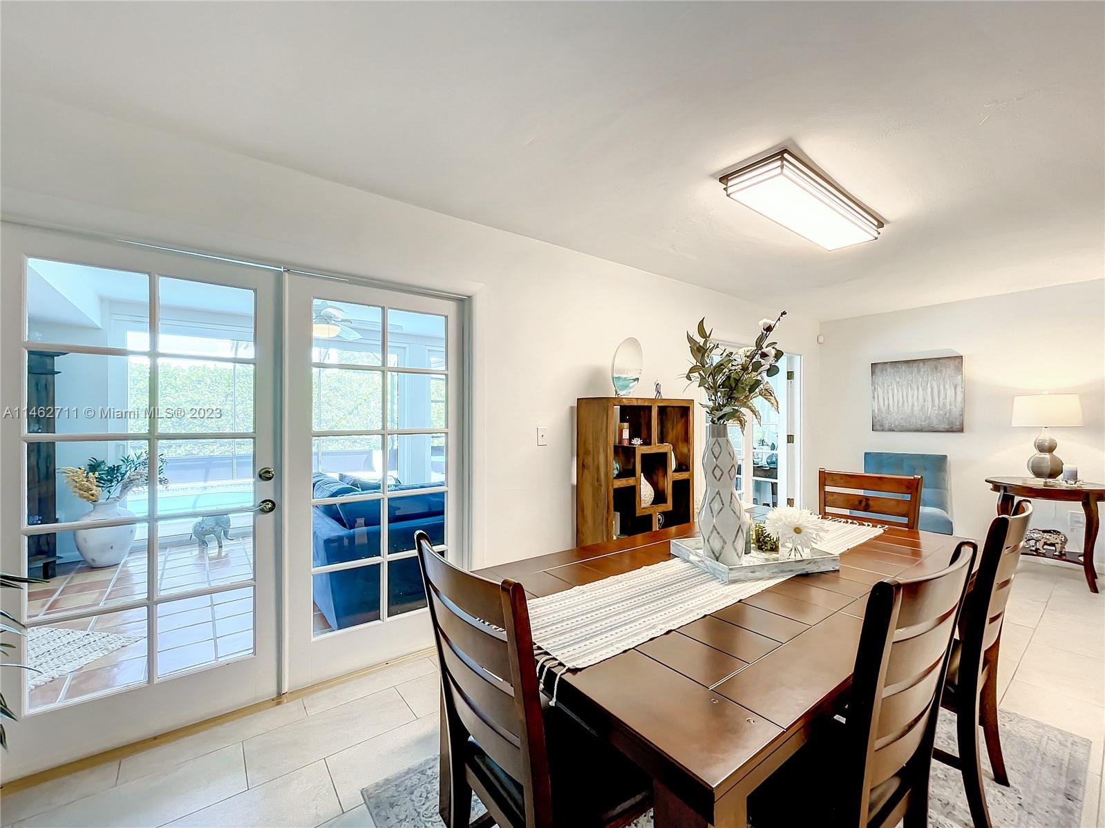 9035 Southwest 48th Terrace Miami, FL 33165 - Photo 7 of 37 a view of a dining room with furniture window and outside view