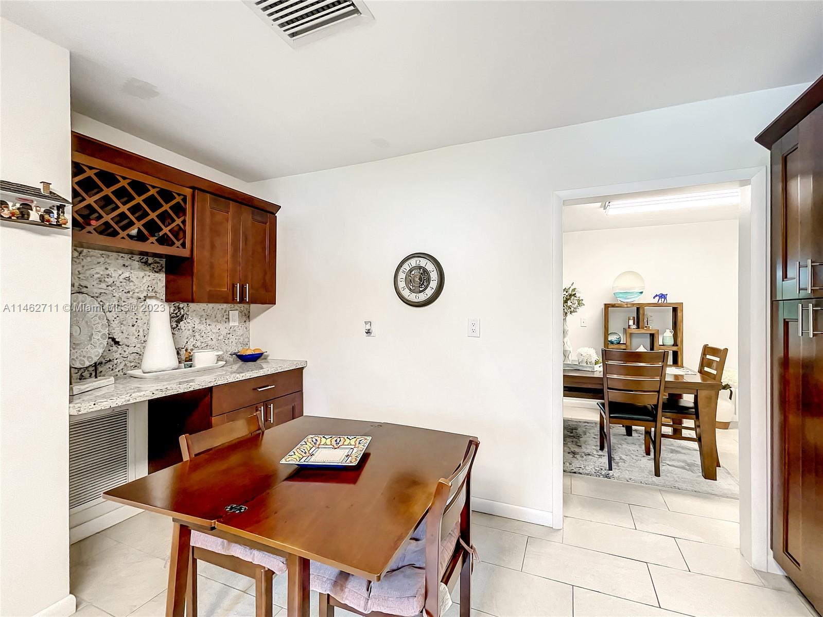 9035 Southwest 48th Terrace Miami, FL 33165 - Photo 8 of 37 a room with furniture and view of kitchen