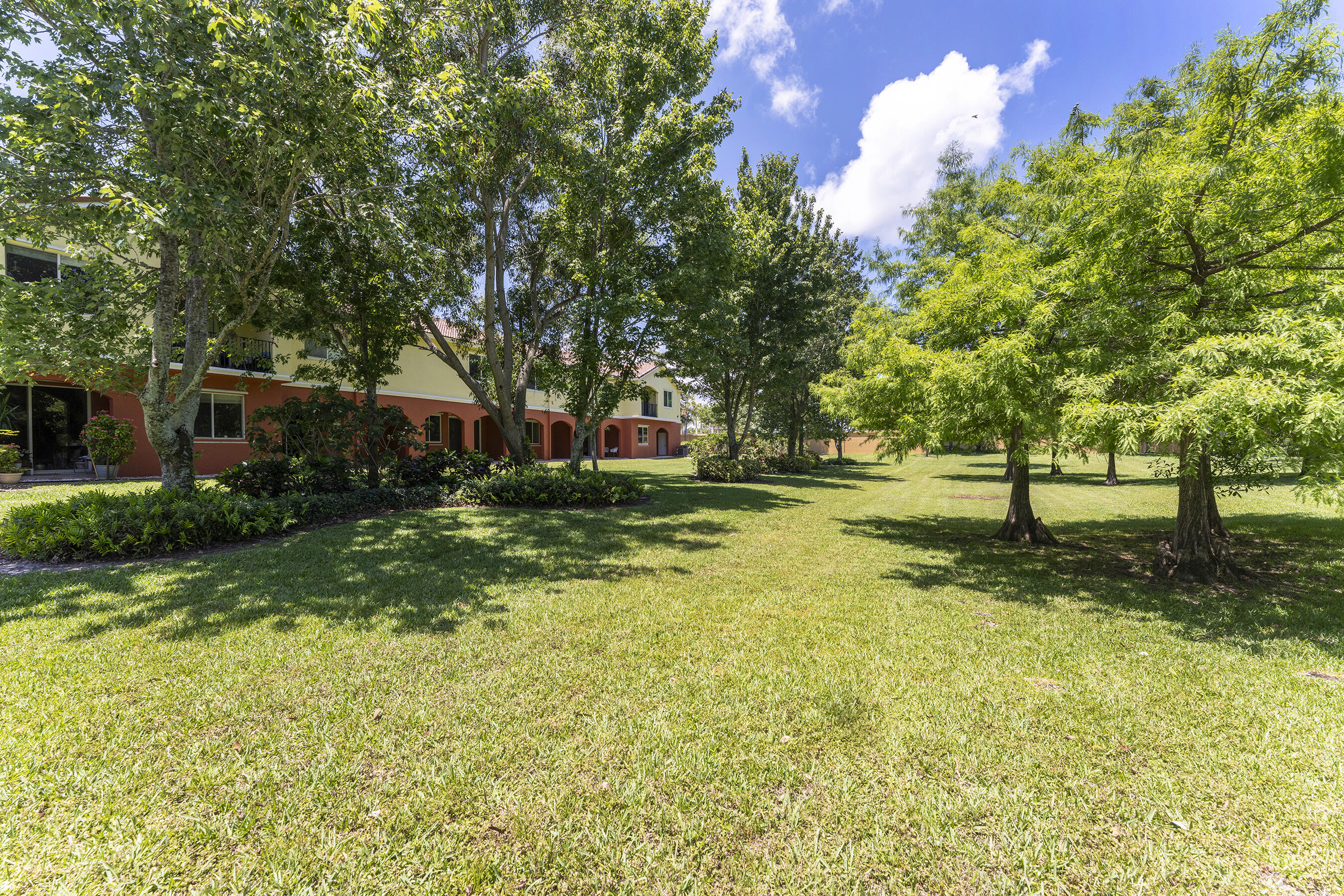 49 Southeast Sedona Circle, Unit 101 Stuart, FL 34994 - Photo 4 of 5 a view of yard with green space
