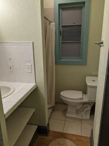 a bathroom with a toilet and a sink