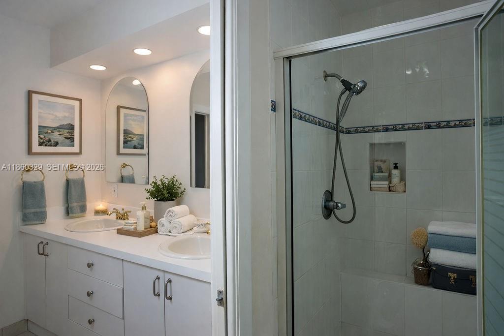 400 St Andrews Road, Unit 56 Hollywood, FL 33021 - Photo 14 of 18 a bathroom with a granite countertop sink mirror and shower