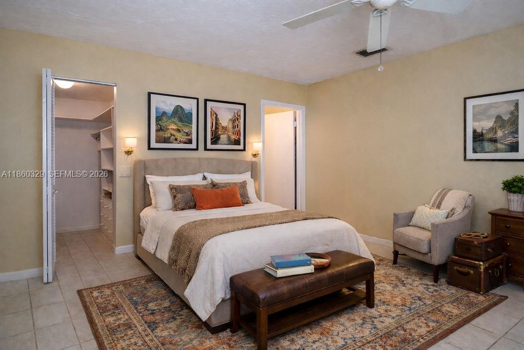 400 St Andrews Road, Unit 56 Hollywood, FL 33021 - Photo 17 of 18 a bedroom with a bed and a couch