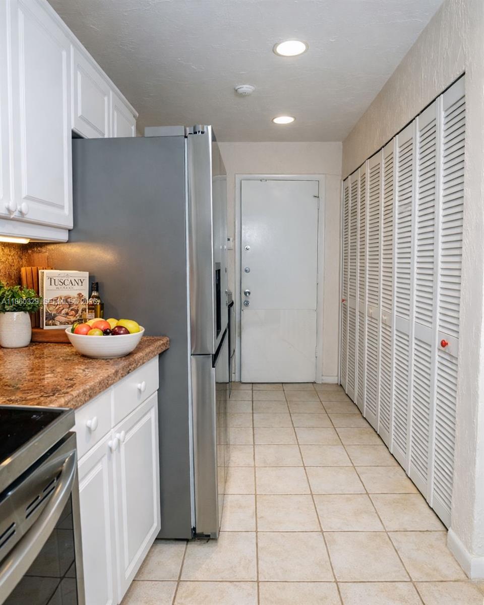 400 St Andrews Road, Unit 56 Hollywood, FL 33021 - Photo 7 of 18 a kitchen with a sink and cabinets