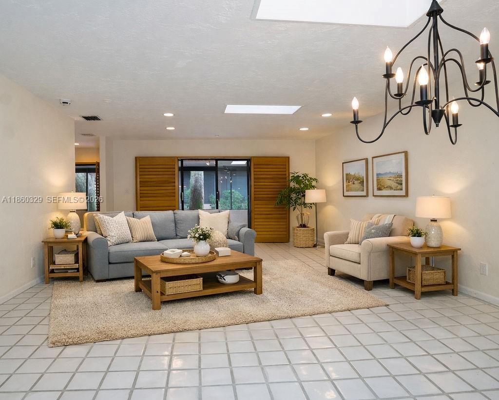 400 St Andrews Road, Unit 56 Hollywood, FL 33021 - Photo 8 of 18 a living room with furniture and wooden floor