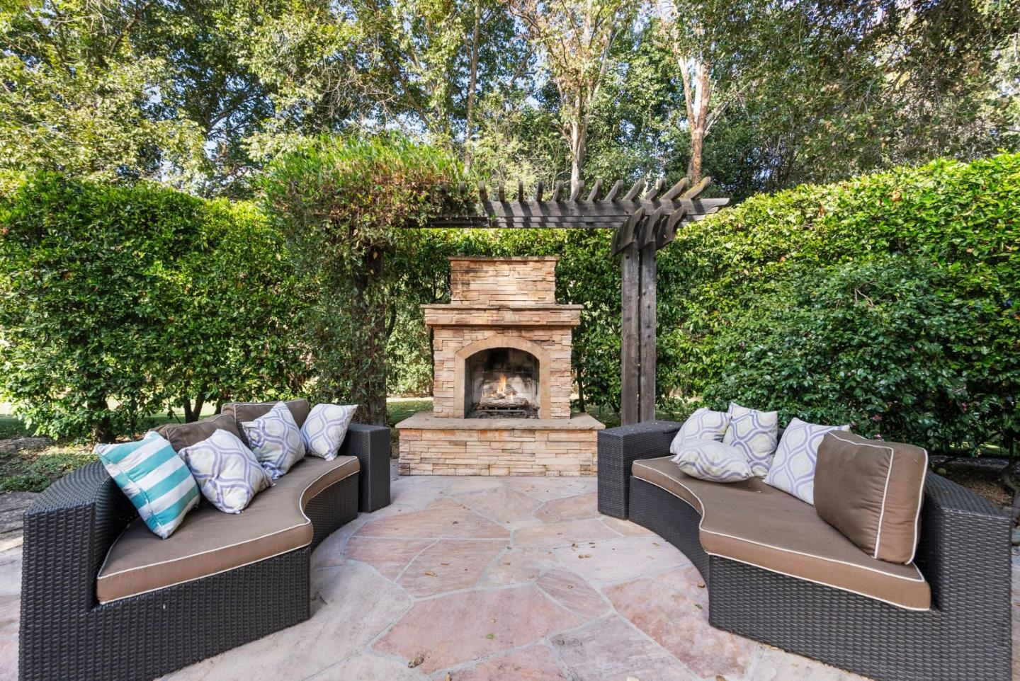 2 Lane Place Atherton, CA 94027 - Photo 32 of 35 a view of patio with couches and a fireplace