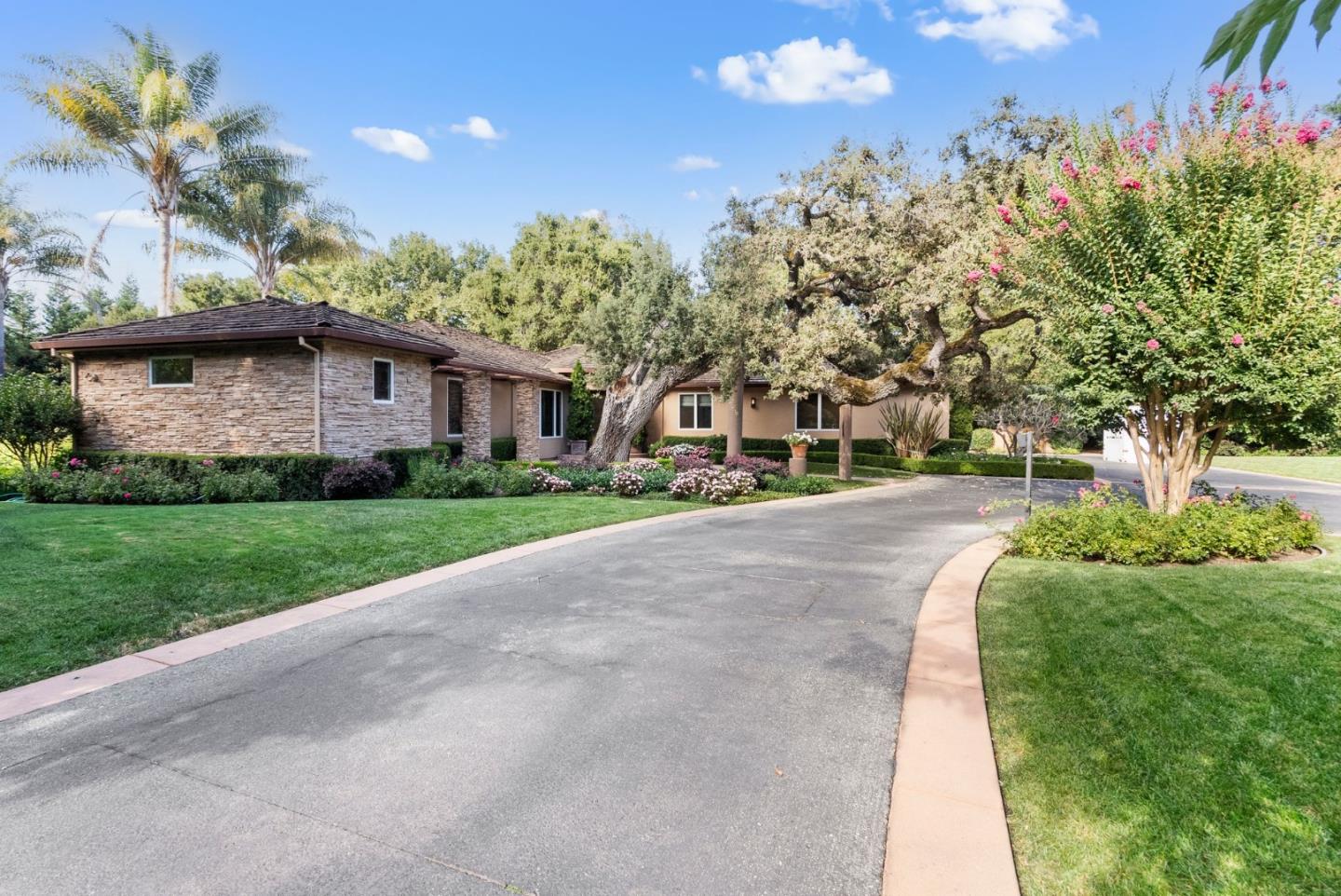 2 Lane Place Atherton, CA 94027 - Photo 6 of 35 a front view of a house with a yard and garage