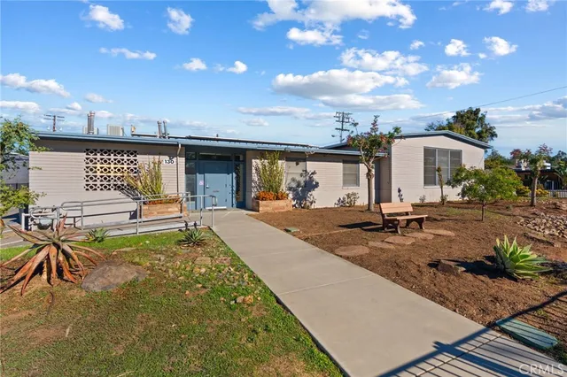 a view of a backyard with sitting area