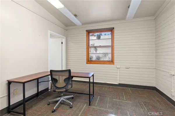a view of a workspace with furniture