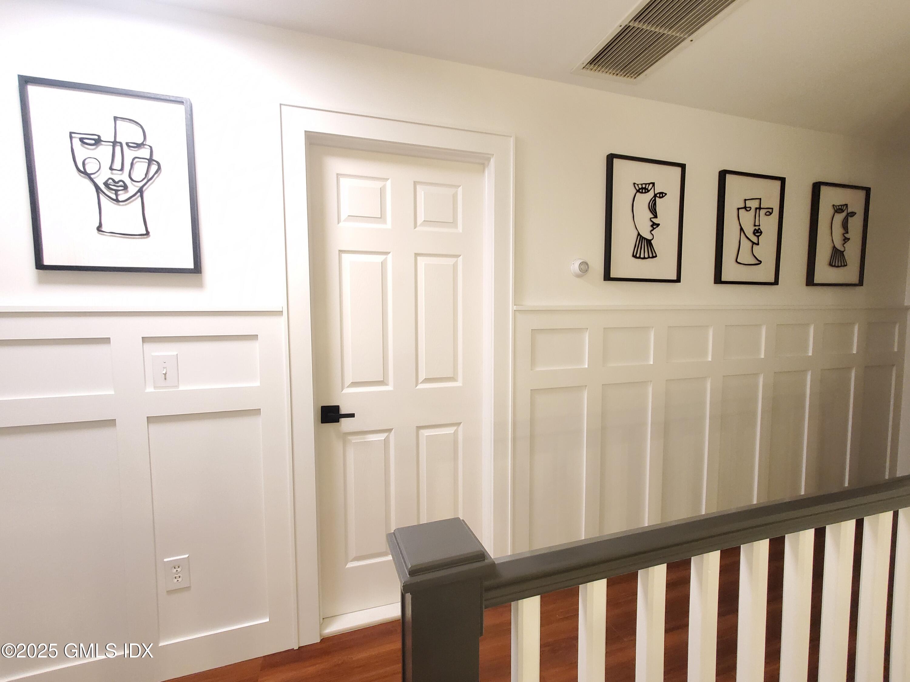92 Valley Road, Unit A Cos Cob, CT 06807 - Photo 20 of 57 a view of a hallway with wooden floor and entryway