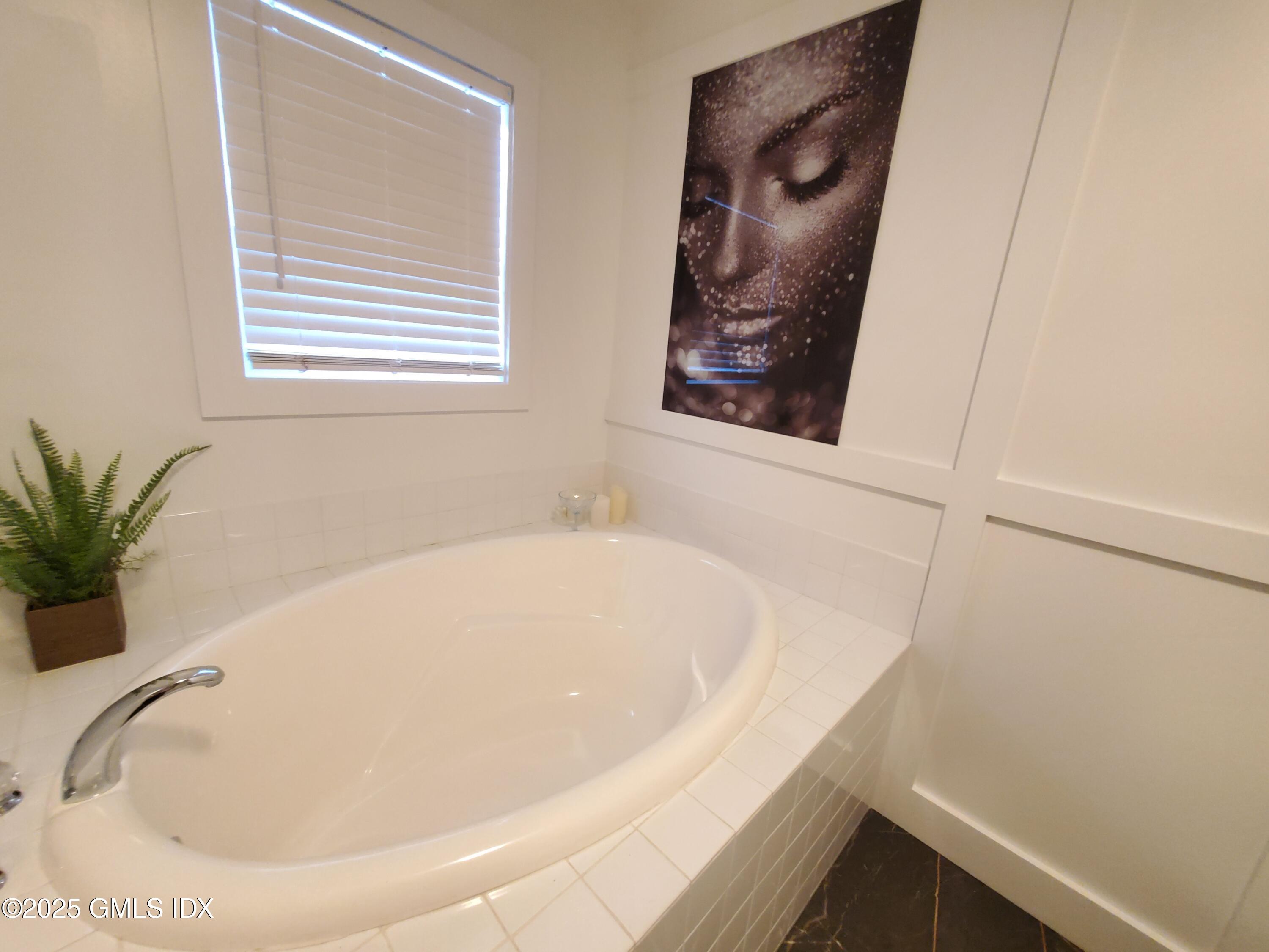 92 Valley Road, Unit A Cos Cob, CT 06807 - Photo 27 of 57 a bathroom with a tub