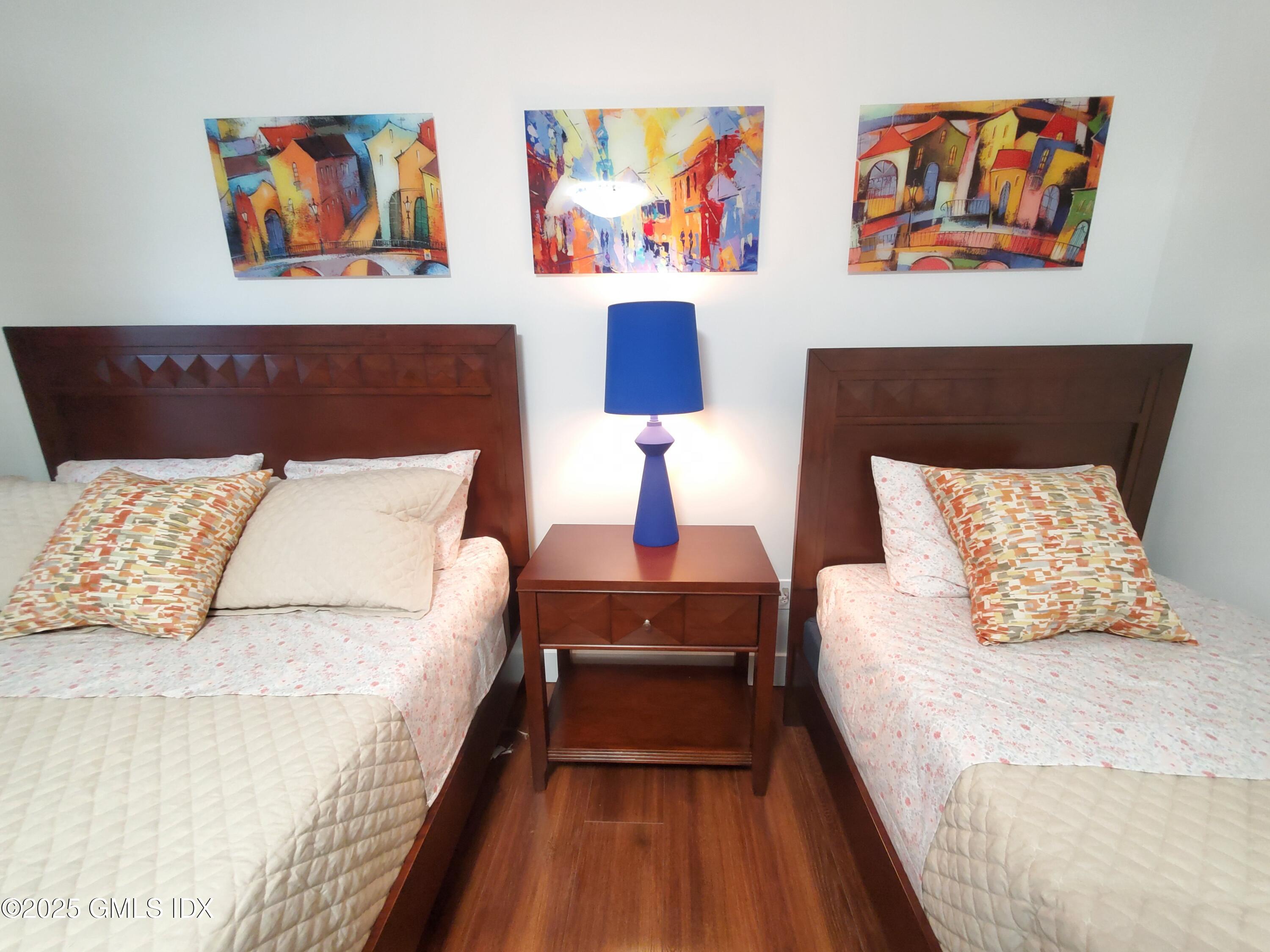 92 Valley Road, Unit A Cos Cob, CT 06807 - Photo 29 of 57 a bed room with a large bed and a couch