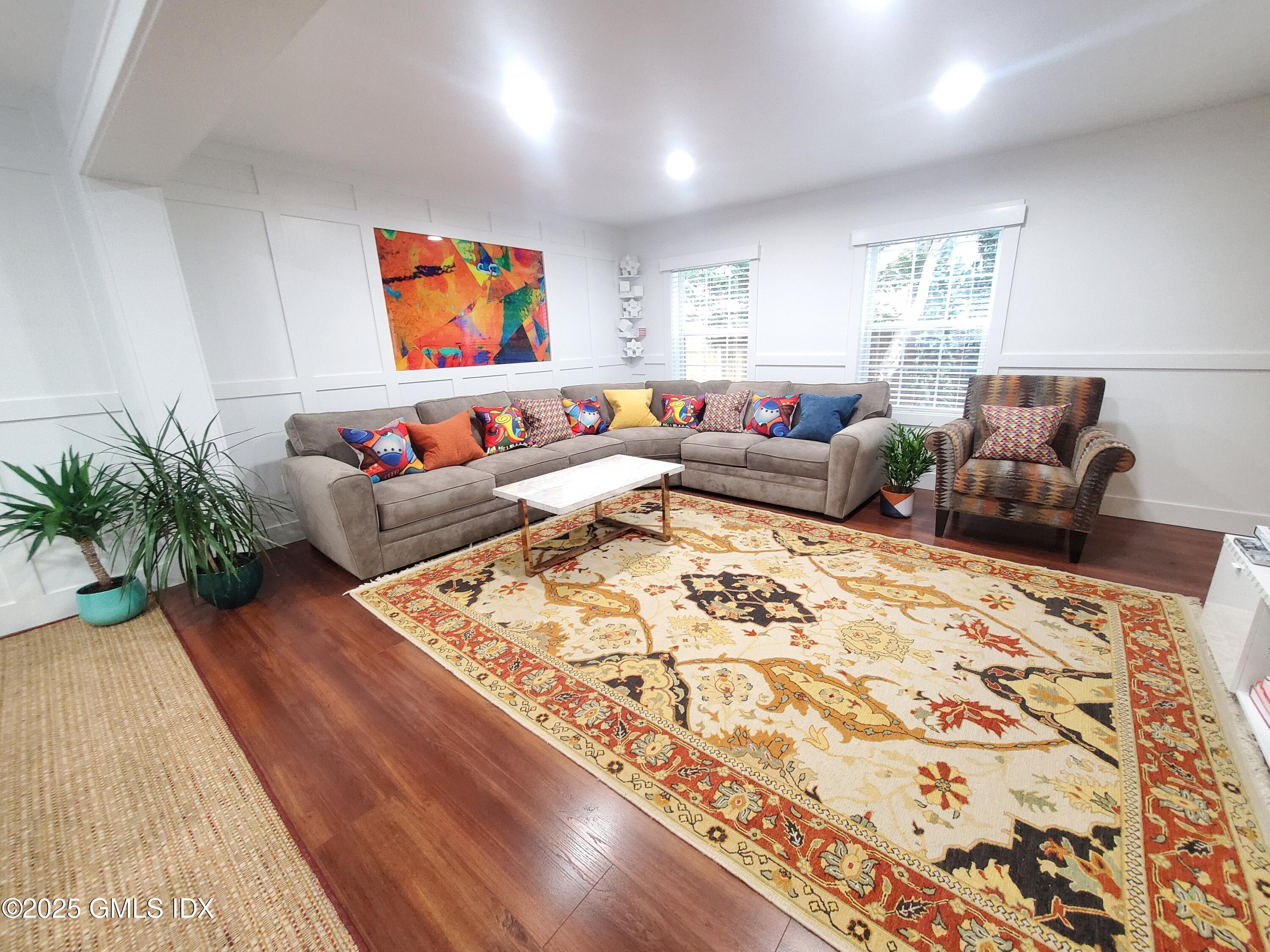 92 Valley Road, Unit A Cos Cob, CT 06807 - Photo 3 of 57 a living room with furniture and a flat screen tv