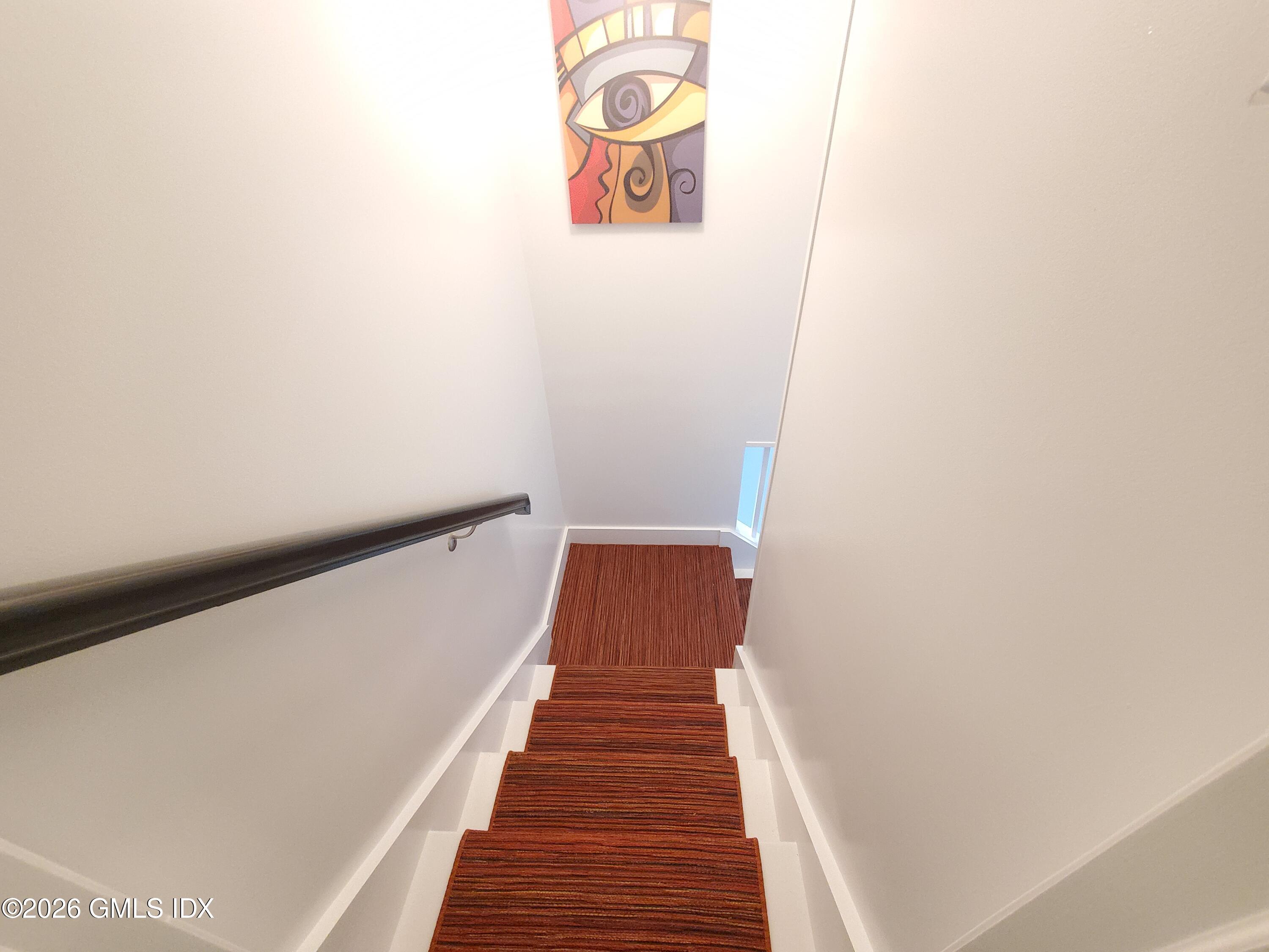 92 Valley Road, Unit A Cos Cob, CT 06807 - Photo 35 of 57 a view of a hallway with wooden floor