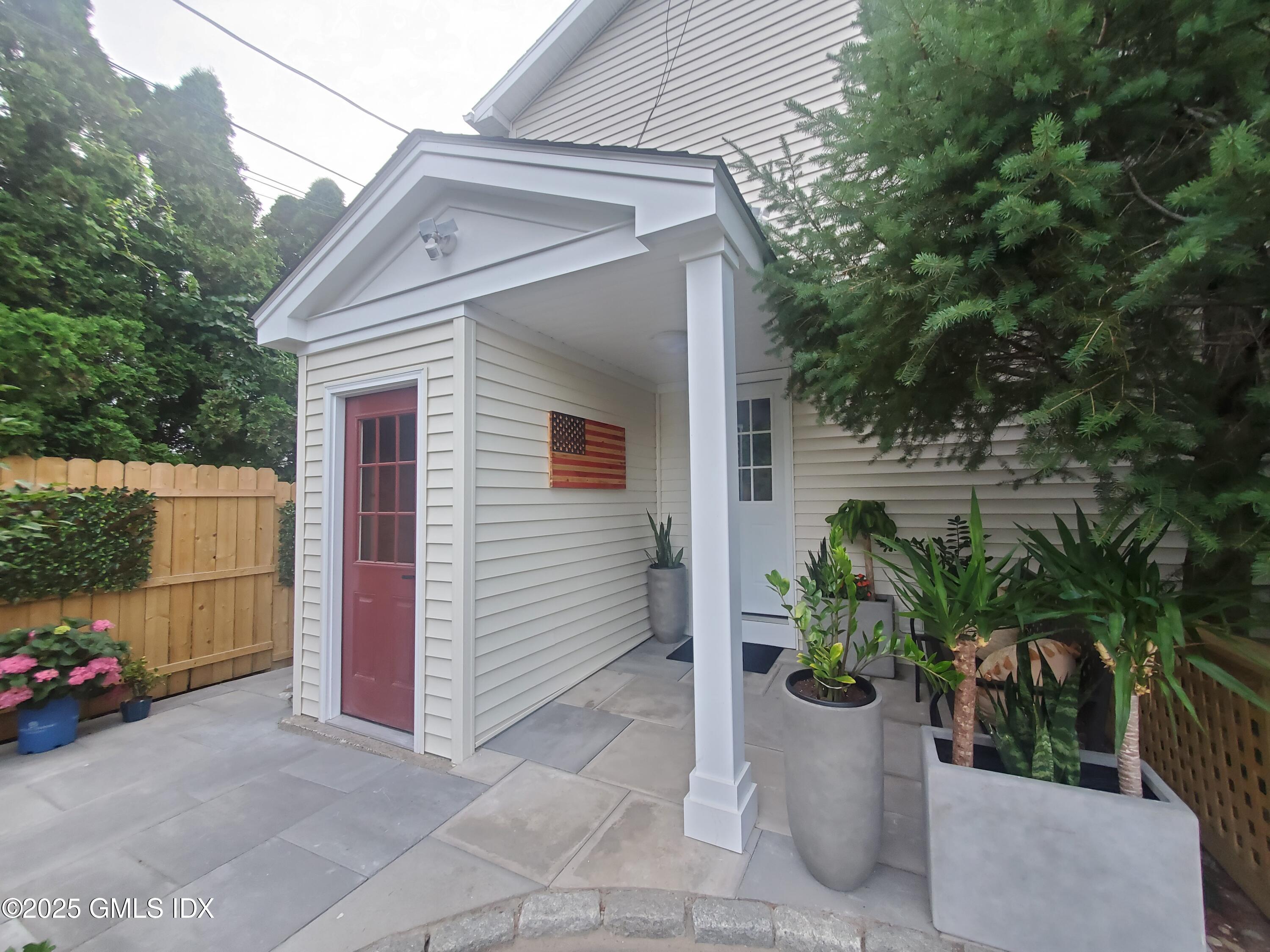 92 Valley Road, Unit A Cos Cob, CT 06807 - Photo 40 of 57 a view of a house with outdoor space and plants