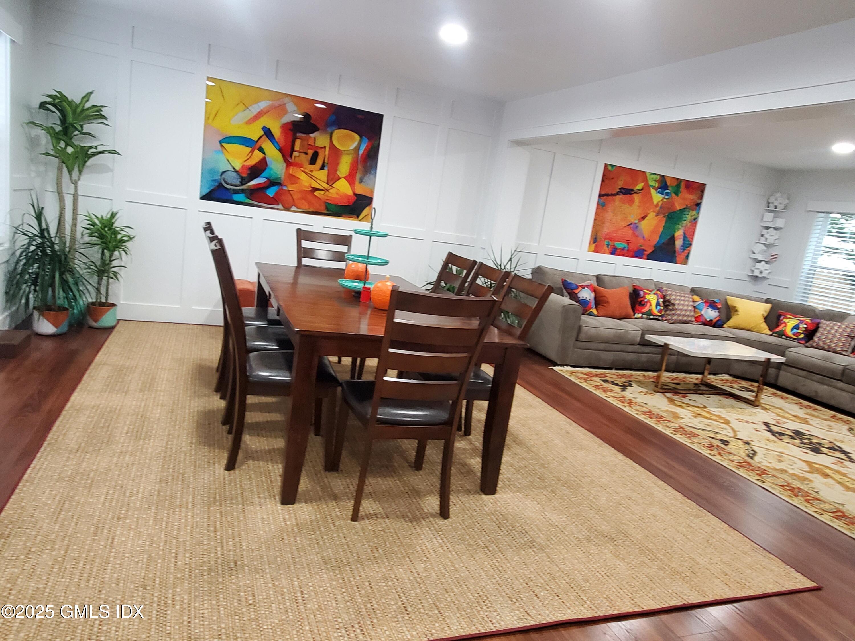 92 Valley Road, Unit A Cos Cob, CT 06807 - Photo 4 of 57 a dining room with furniture and painting on the wall