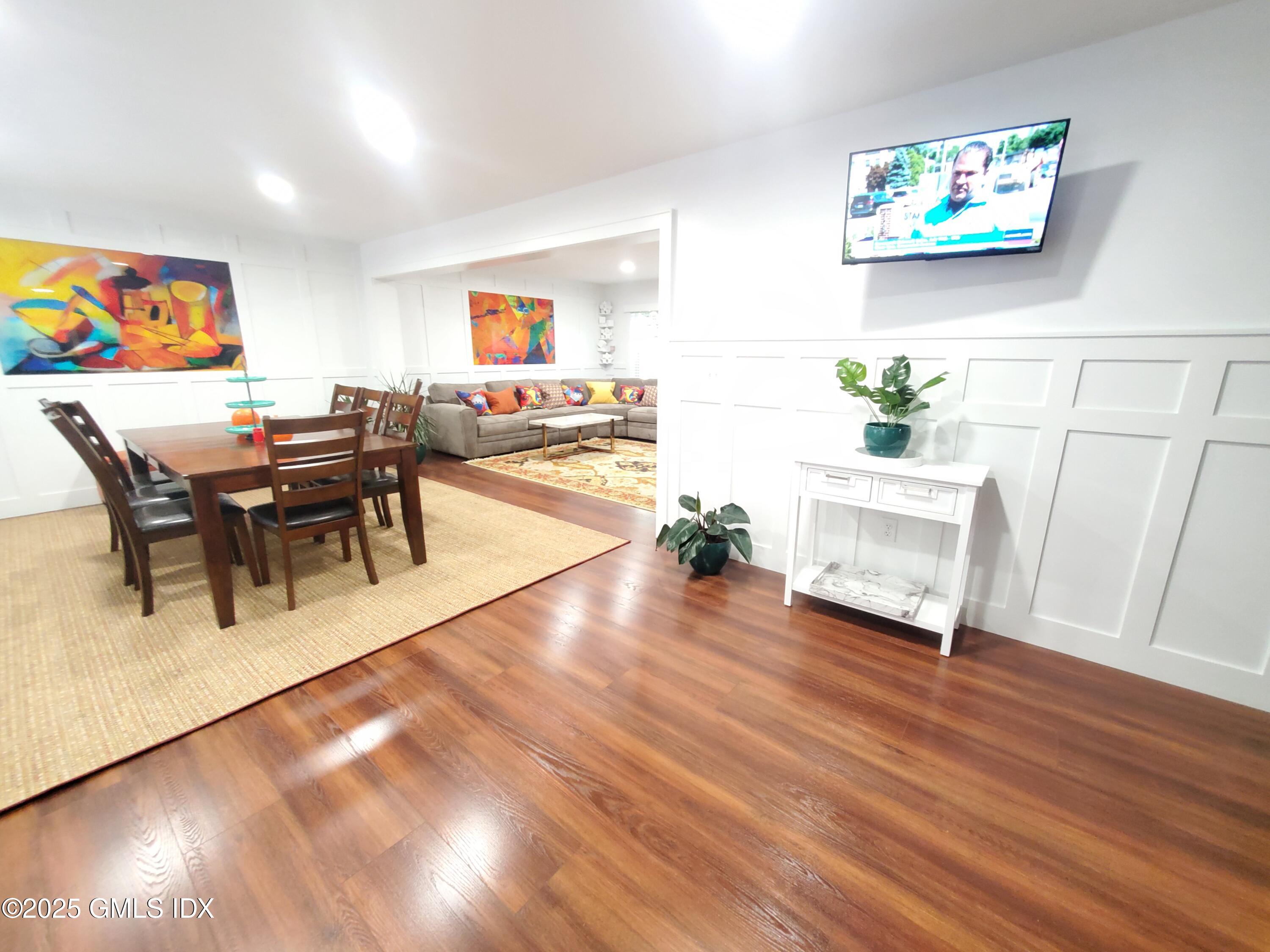 92 Valley Road, Unit A Cos Cob, CT 06807 - Photo 9 of 57 a living room with furniture and a wooden floor